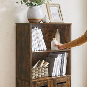 Top surface of the rustic brown cabinet styled with a plant pot and a framed picture