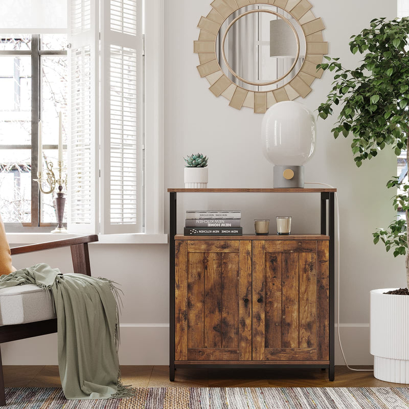 Rustic brown cabinet beside a bed holding books and a folded blanket