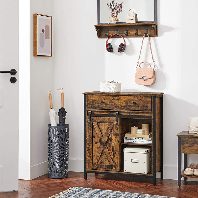 Rustic brown cabinet in a hallway under a coat rack with bags and an umbrella stand