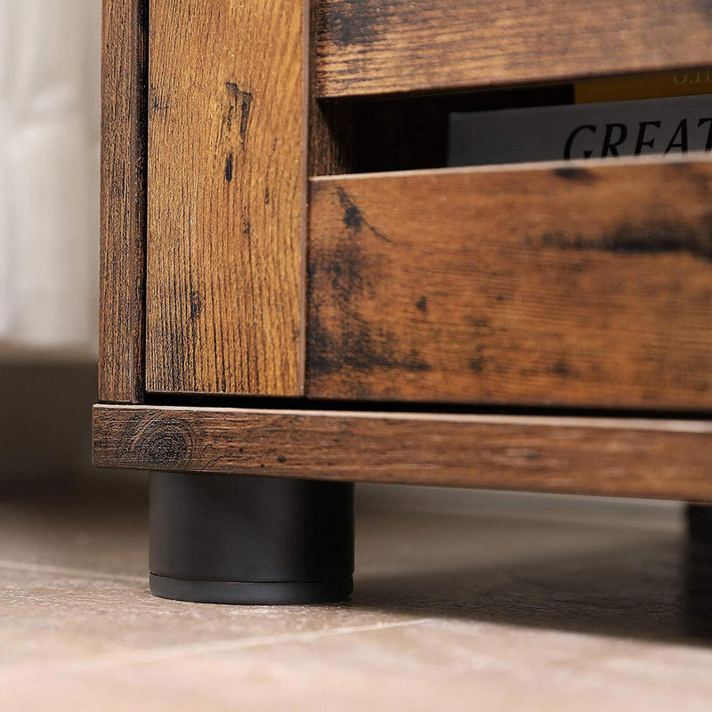 Close-up of the rustic wood grain finish and the slatted louvered door edge