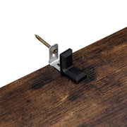 Anti-tip wall bracket and fixing screw shown on the cupboard panel