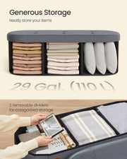 Open ottoman interior with two removable dividers holding folded blankets and pillows, 110 litre capacity.