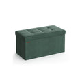Retro green storage ottoman bench with tufted lid closed on a plain background