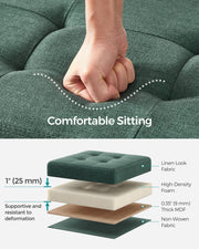 Hand pressing the tufted seat above a cutaway of the fabric, foam, MDF and base layers