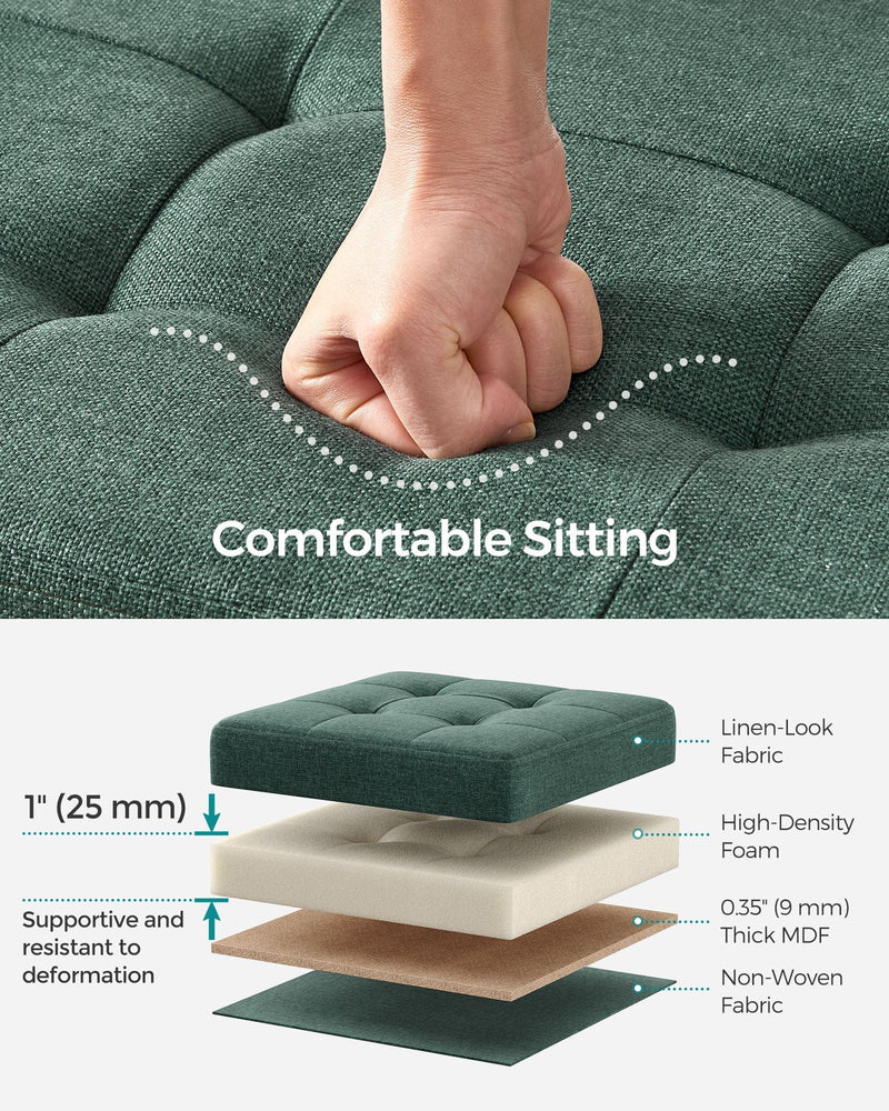 Hand pressing the tufted seat above a cutaway of the fabric, foam, MDF and base layers