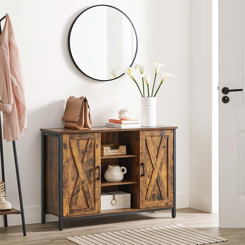 Rustic brown sideboard in a hallway below a round mirror with a vase and cups on top