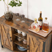 Close-up of the sideboard top set out as a drinks station with glasses and a decanter
