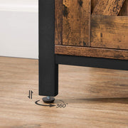 Close-up of a black steel leg with an adjustable foot on a wooden floor