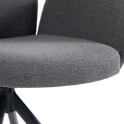 Close-up of the padded grey fabric seat cushion and chair arm