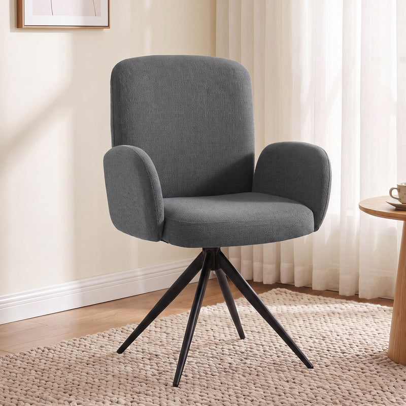 Grey swivel accent chair in a bright living room beside a wooden side table