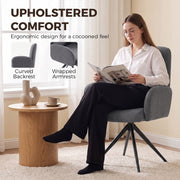 Woman reading in the grey swivel accent chair with curved backrest and wrapped armrests