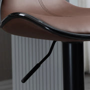 Close-up of the moulded brown seat edge and black height-adjustment lever