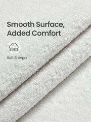 Close-up of the folded white sherpa fabric showing its soft looped texture
