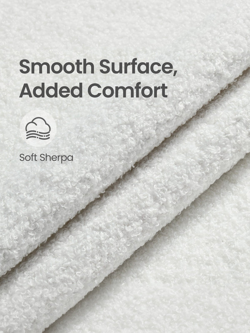 Close-up of the folded white sherpa fabric showing its soft looped texture
