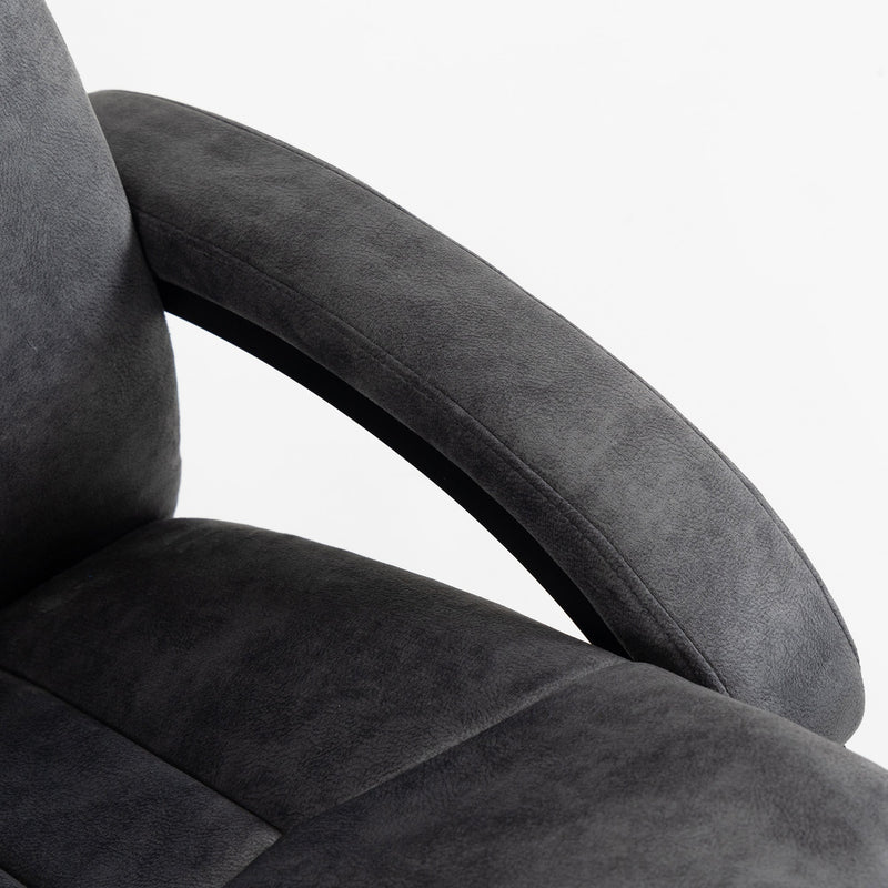 Detail of the curved padded armrest meeting the thick seat cushion