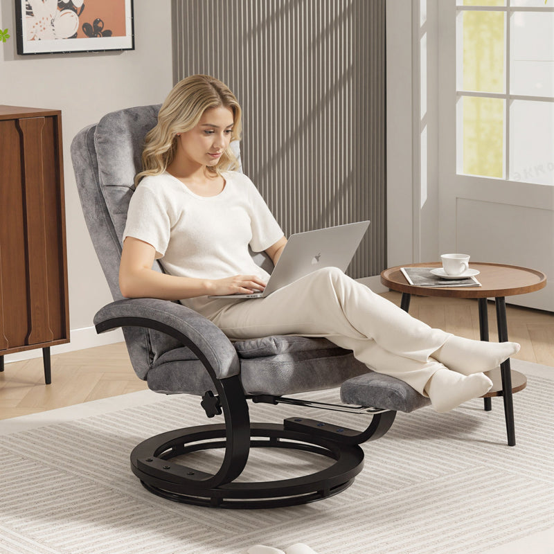 Woman working on a laptop in the recliner with her feet up on the footrest beside a sideboard