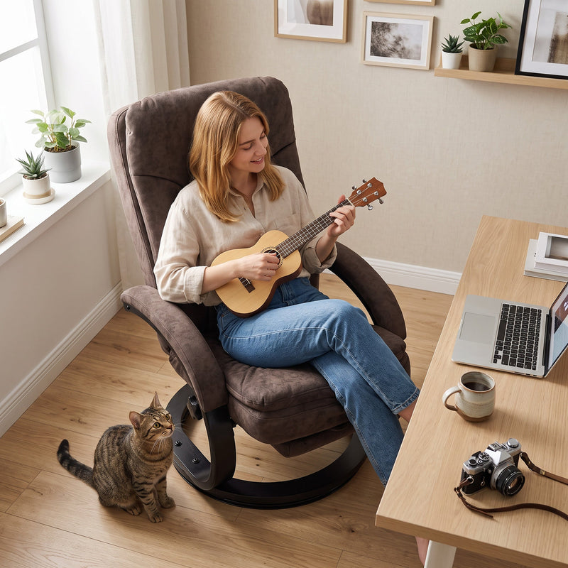 Woman playing a ukulele in the swivel recliner beside a desk and laptop