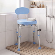 Light blue swivel shower chair in a tiled shower corner with a folded towel on the seat