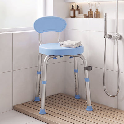 Light blue swivel shower chair in a tiled shower corner with a folded towel on the seat