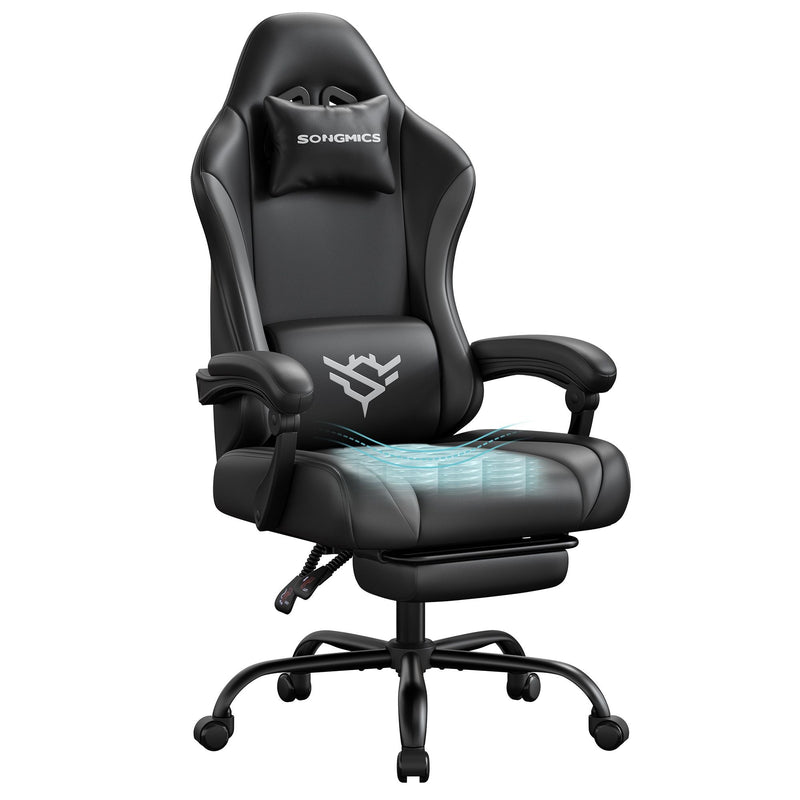 Ink black and slate grey synthetic leather gaming chair with footrest, studio shot