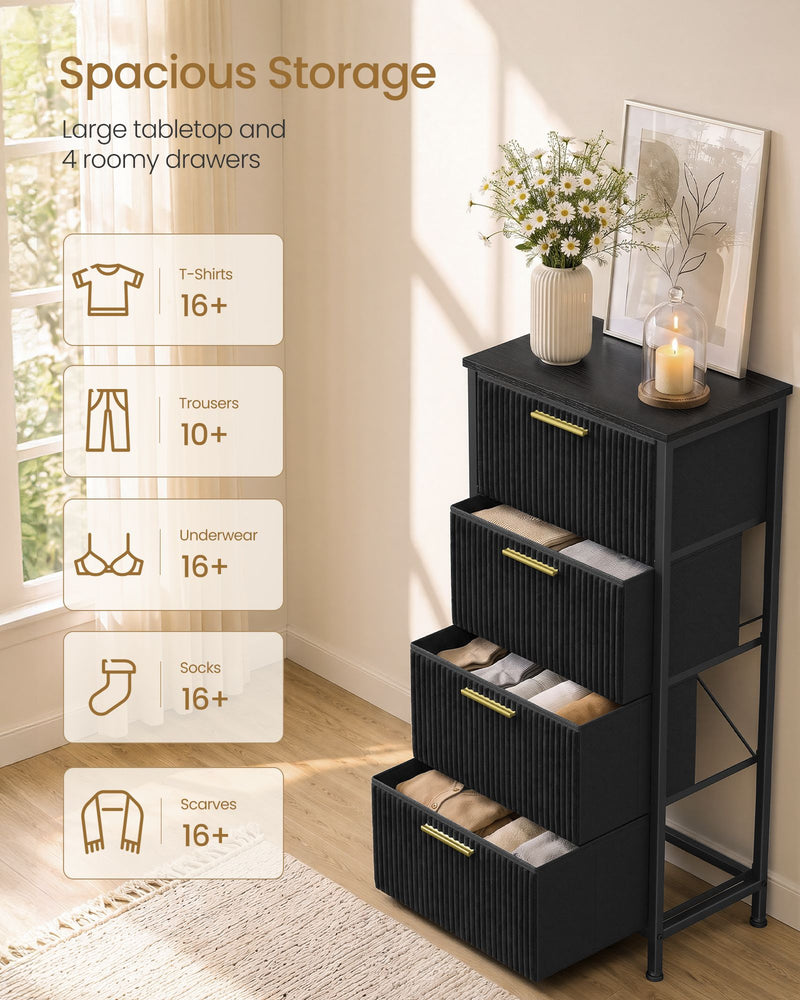 Open drawers on the black chest showing storage space for folded clothes
