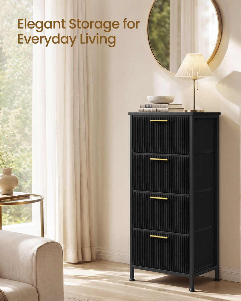 Black corduroy chest styled in a bedroom beside a bed and soft furnishings