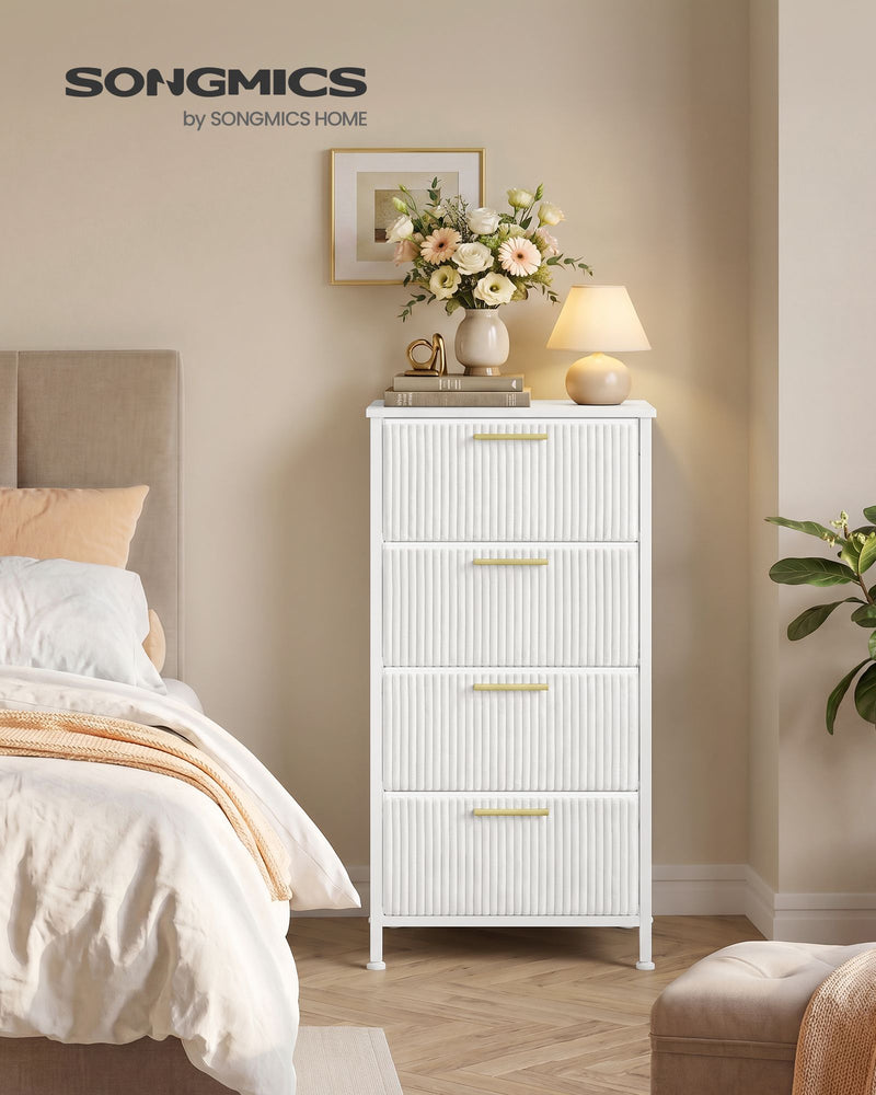 Songmics by Songmics Home branded lifestyle shot of the white corduroy chest with fresh flowers and a round mirror