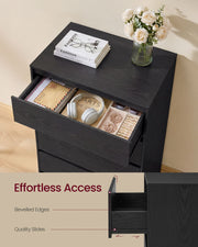 Black chest with an open drawer of headphones and jewellery and bevelled edge callouts
