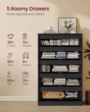 Black chest with 5 drawers of folded clothes and storage counts for T-shirts and trousers