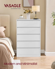 White 5 drawer chest beside a bed with a lamp and plant on top