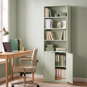 Light green bookcase in a home office beside a desk