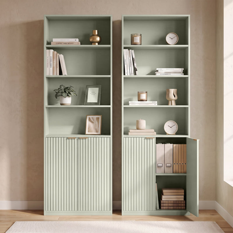 Two bookcases side by side, one with the cabinet door open showing files and books