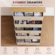 Five fabric drawers pulled open and filled with folded clothes