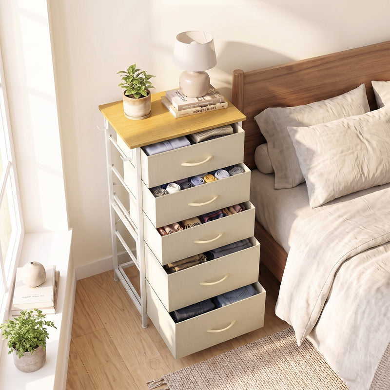 Chest of drawers in a bedroom with several drawers pulled open, shown in beige