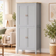 Grey pantry cupboard in a living space next to an armchair and plant