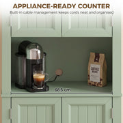 Open countertop compartment of the sage green cupboard holding a coffee machine, labelled 68.5 cm wide