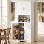 White tall kitchen cupboard in a dining room with a lower door open to show spice racks