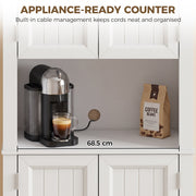 Open countertop compartment of the white cupboard holding a coffee machine, labelled 68.5 cm wide
