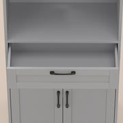 Close-up of the open drawer and black handles on the grey pantry
