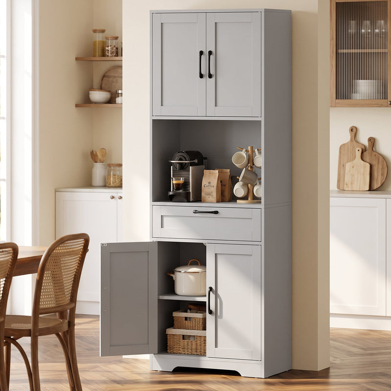 Grey kitchen pantry in a dining room with the lower cupboard open showing a pot and baskets