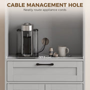 Open counter close-up with a cable management hole and a coffee machine above the drawer