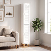 Tall white cabinet in a living room beside a sofa and fiddle-leaf plant