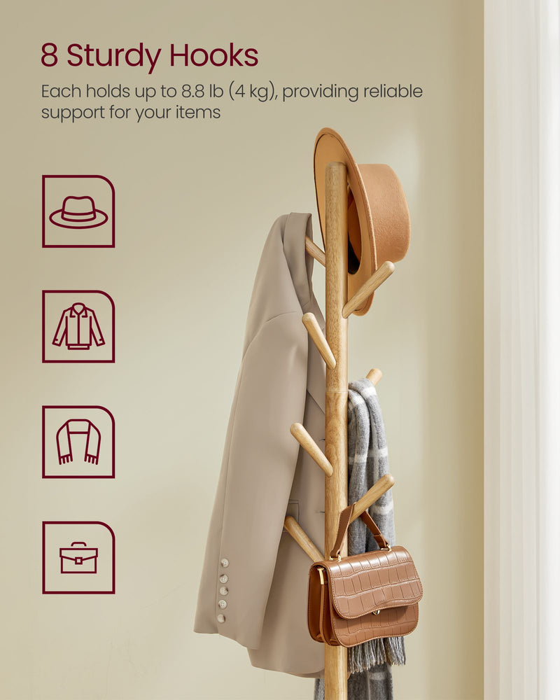 Close-up of coat rack hooks holding a coat, hat, scarf and bag