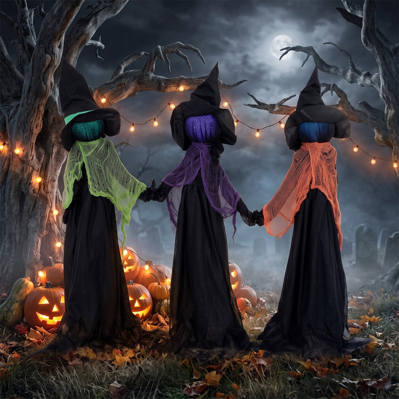 Three witches holding hands display among pumpkins and string lights at night