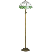 Full-length studio view of the floor lamp with the stained glass shade unlit