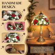 Handmade stained glass process panel with a lit red floral lamp on a side table