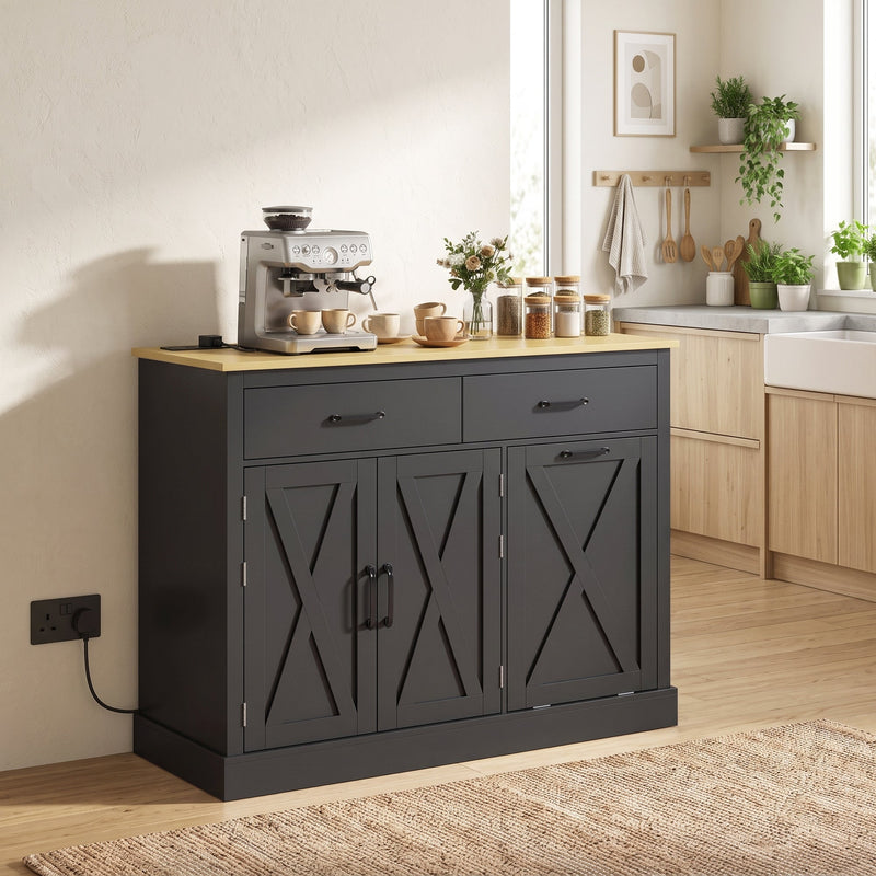 Black tilt out trash cabinet styled as a kitchen island with a coffee maker and crockery on the worktop