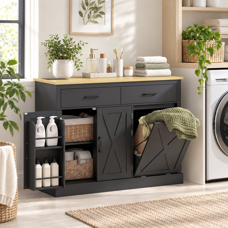 Black cabinet used in a laundry room with a fabric hamper insert, wicker baskets and folded towels