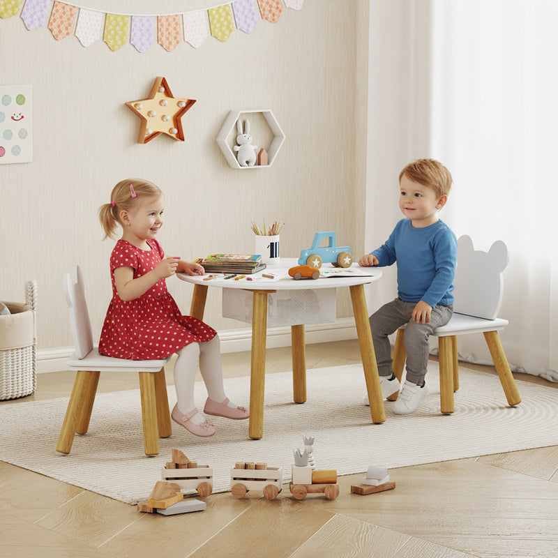 Two children using the toddler table and chair set for crafts