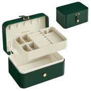 Forest green Songmics travel jewellery case shown open with its lift-out tray, and closed behind
